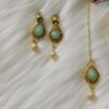 mint earrings and tikka
