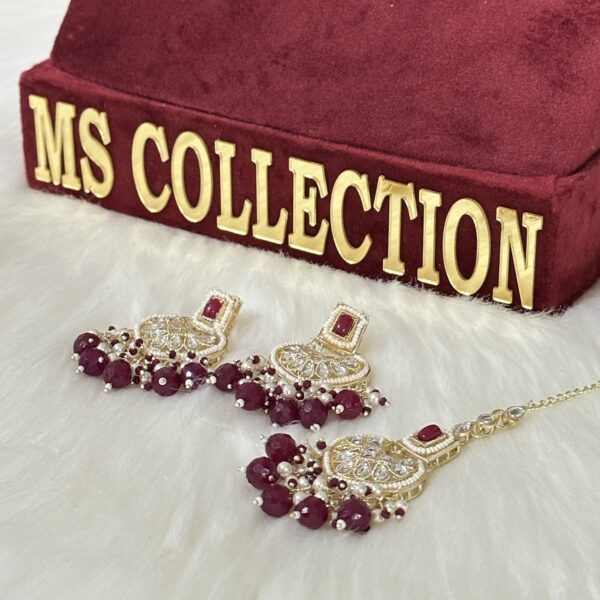 Maroon Kundan earrings and tikka